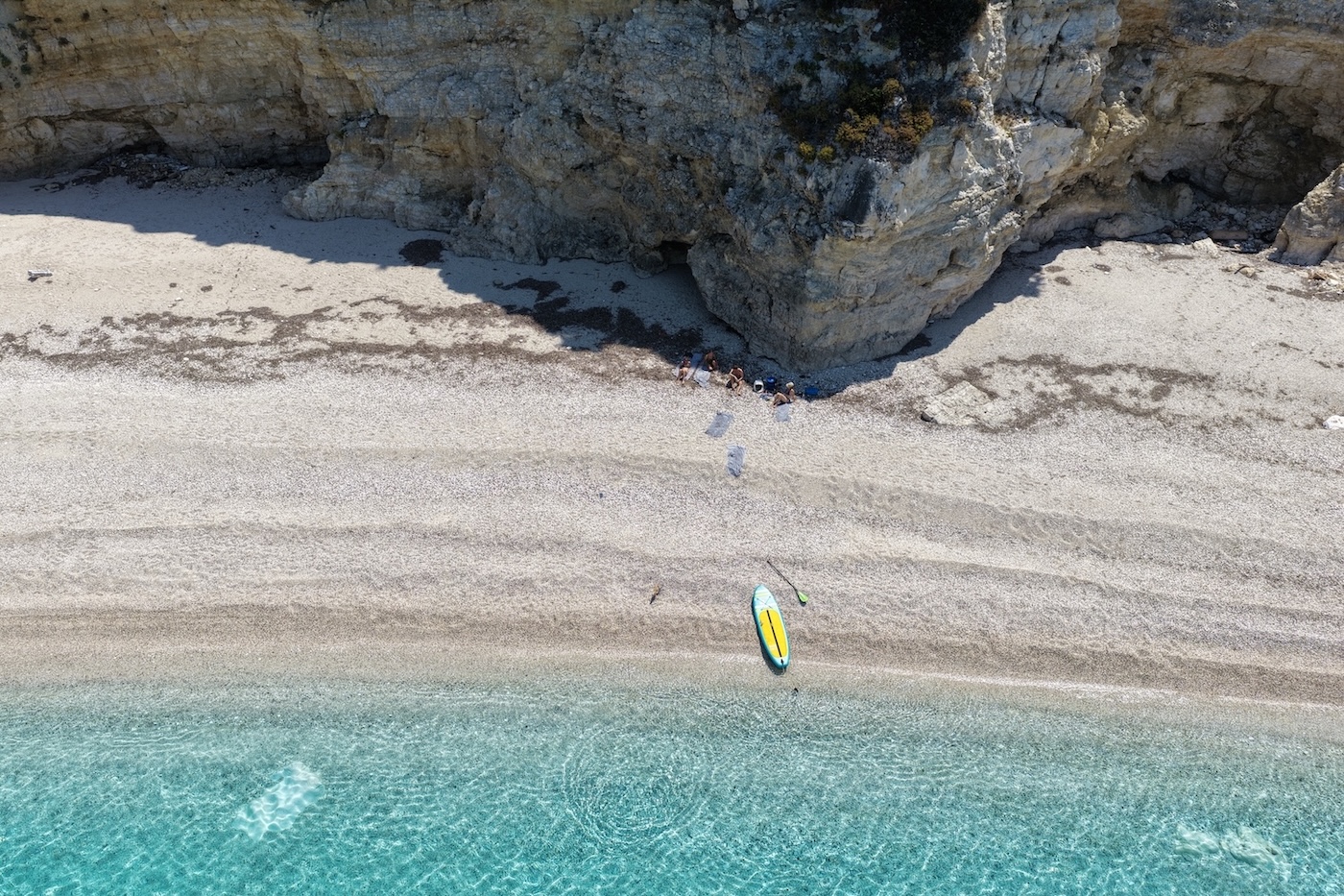 A beach and turquoise water in the Ionian Islands