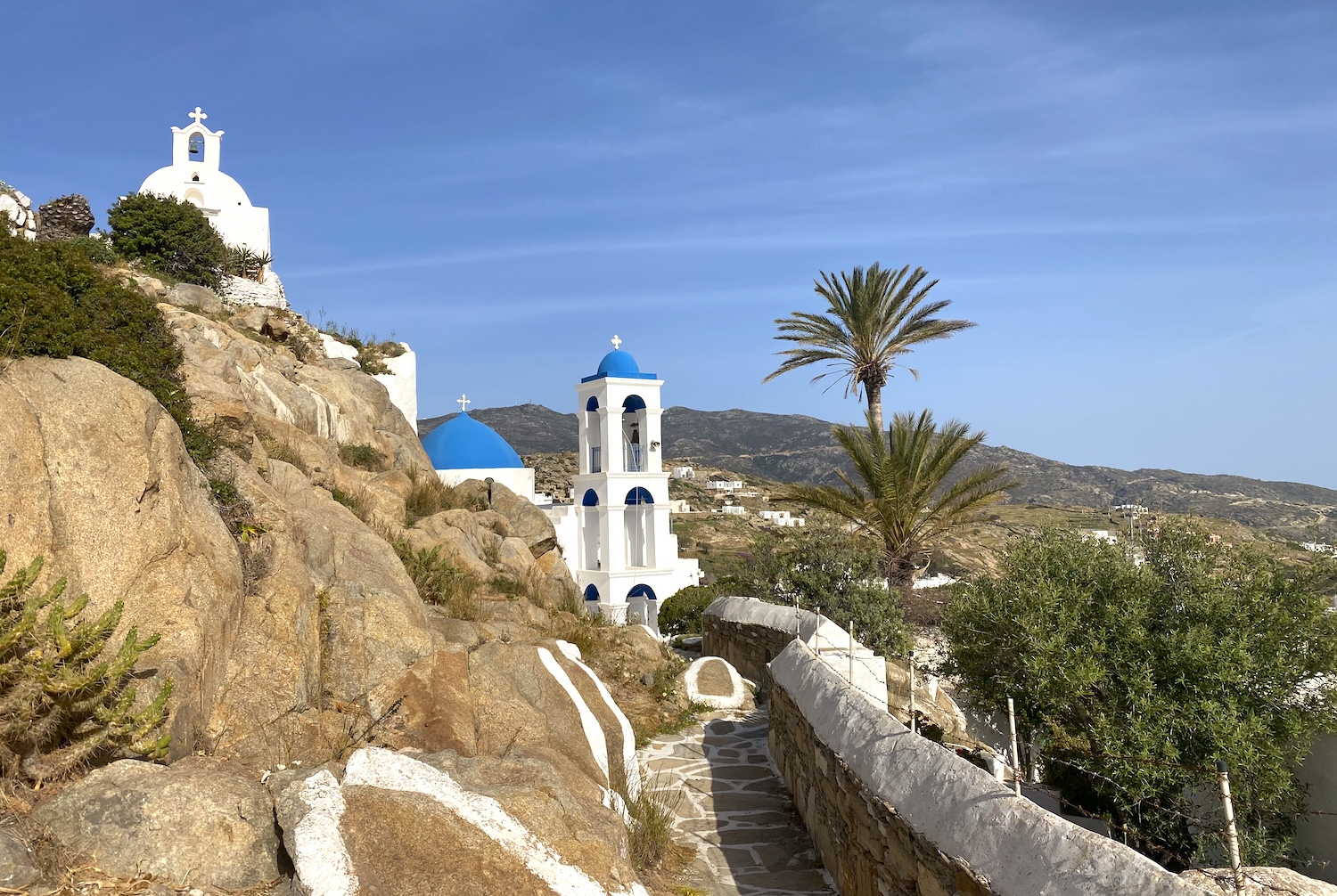 A whitewashed church on the hill above Ios Chora