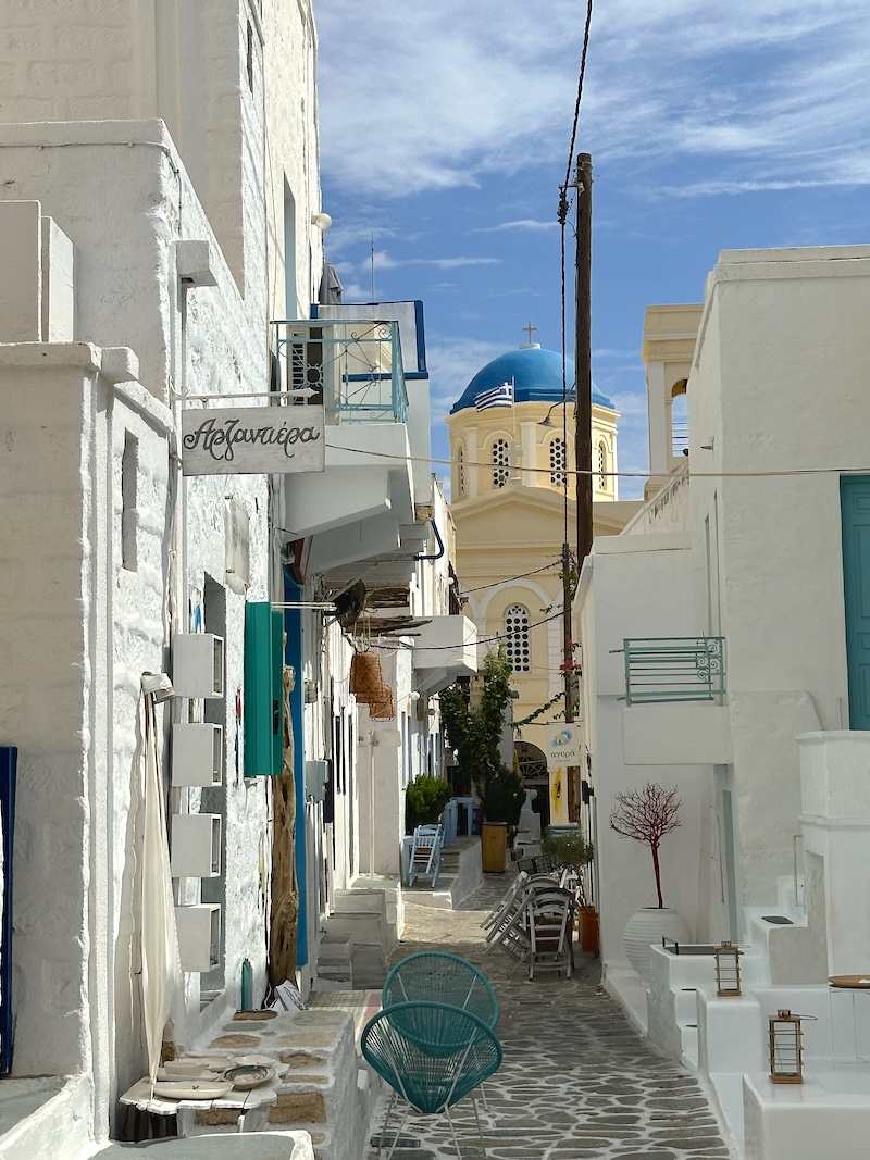 A whitewashed lane and church in Kimolos Chora